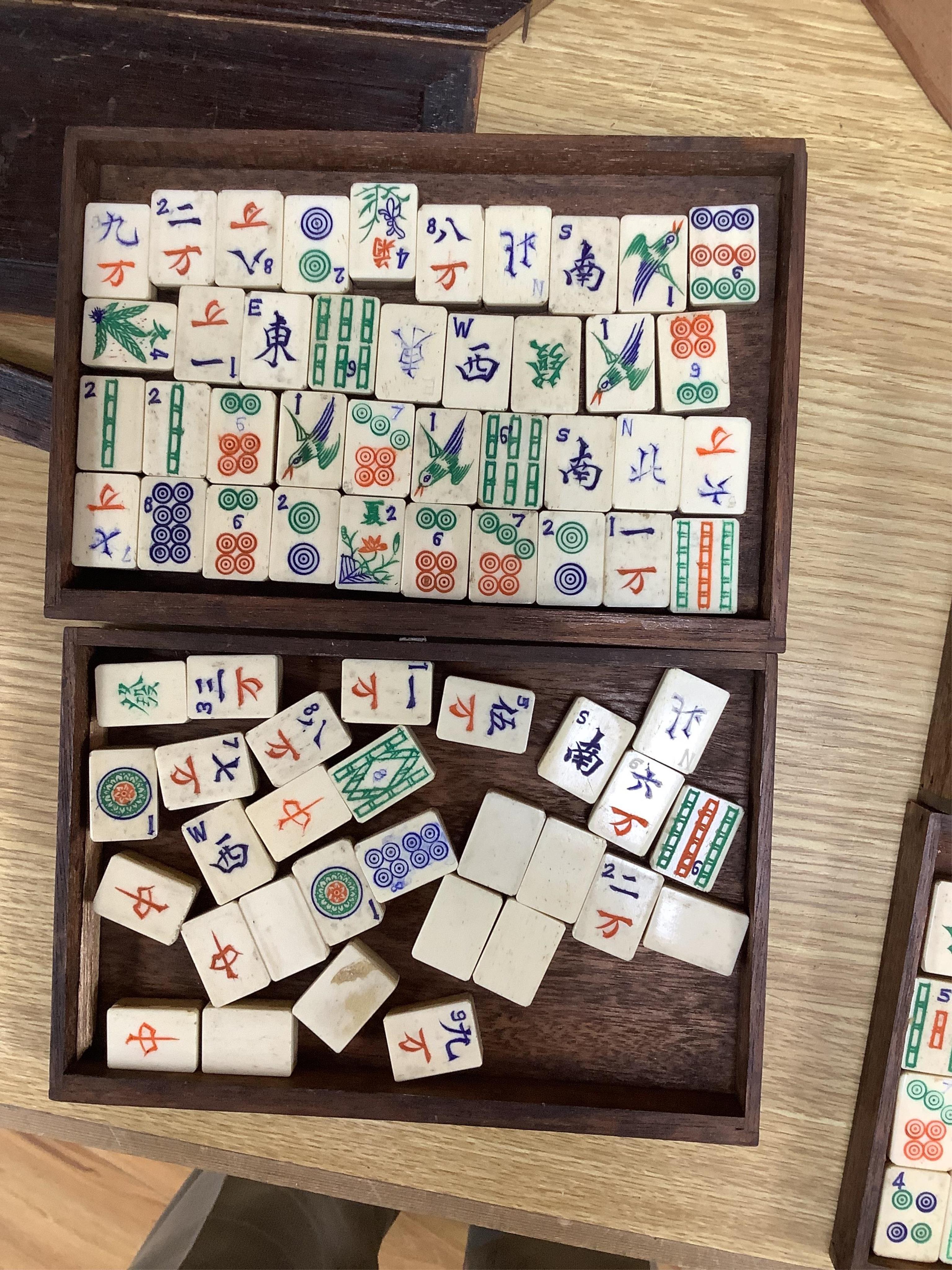 A cased Chinese Mahjong set, bone pieces